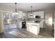 Modern kitchen with white cabinets, quartz countertops, and island at 355 Holland Springs Way, Powder Springs, GA 30127