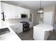 Modern kitchen with white cabinets and quartz countertops at 355 Holland Springs Way, Powder Springs, GA 30127