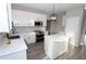 Modern kitchen with white cabinets, quartz countertops, and island at 355 Holland Springs Way, Powder Springs, GA 30127