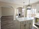 Kitchen with island, view into Gathering room with fireplace at 355 Holland Springs Way, Powder Springs, GA 30127