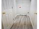 Laundry room with vinyl flooring and white doors at 355 Holland Springs Way, Powder Springs, GA 30127