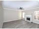 Spacious living room with fireplace and gray vinyl plank flooring at 355 Holland Springs Way, Powder Springs, GA 30127