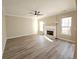 Bright living room featuring hardwood floors and a fireplace at 355 Holland Springs Way, Powder Springs, GA 30127