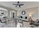 Stylish living room featuring modern furniture, a ceiling fan, and contemporary decor at 355 Holland Springs Way, Powder Springs, GA 30127