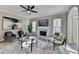 Living room features decorative fireplace, area rug, modern furniture and lots of light at 355 Holland Springs Way, Powder Springs, GA 30127