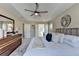 Bright primary bedroom with trey ceiling, ceiling fan, and large windows at 355 Holland Springs Way, Powder Springs, GA 30127