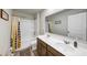Bright bathroom featuring a double sink vanity with white countertop, tub and shower combination, and neutral color scheme at 8819 Sibella Ct, Lithia Springs, GA 30122