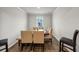 Formal dining room with a wooden table and beige chairs at 8819 Sibella Ct, Lithia Springs, GA 30122