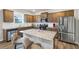 Modern kitchen featuring stainless steel appliances, granite countertops and center island at 8819 Sibella Ct, Lithia Springs, GA 30122