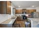 Modern kitchen with granite countertops and wooden cabinets at 8819 Sibella Ct, Lithia Springs, GA 30122