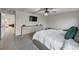 Spacious main bedroom features a platform bed, mounted tv, dual dresser, with a view to another room at 8819 Sibella Ct, Lithia Springs, GA 30122