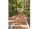 Charming wooded pathway leading to a tranquil setting at 2125 Clay Rd, Austell, GA 30106