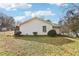 A backyard featuring a grassy area, chain-link fence, and a small shed or outbuilding at 50 Silver Tip Ct, Mcdonough, GA 30253