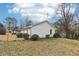 A home's backyard featuring a spacious grass area and surrounded by a chain link fence at 50 Silver Tip Ct, Mcdonough, GA 30253