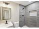 Modern bathroom featuring gray tile shower with niche and dark fixtures at 50 Silver Tip Ct, Mcdonough, GA 30253