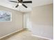 Bedroom featuring laminate wood flooring, ceiling fan and a window at 50 Silver Tip Ct, Mcdonough, GA 30253