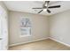 Well-lit bedroom with wood-look flooring and a ceiling fan for added comfort at 50 Silver Tip Ct, Mcdonough, GA 30253