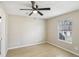 Cozy bedroom featuring laminate floors, ceiling fan, and a window at 50 Silver Tip Ct, Mcdonough, GA 30253