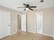 Bedroom with laminate floors, closet access, and adjoining bathroom at 50 Silver Tip Ct, Mcdonough, GA 30253