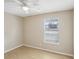 Bright bedroom with laminate floors, ceiling fan, and window with blinds at 50 Silver Tip Ct, Mcdonough, GA 30253