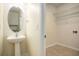 This is a spacious powder room with vanity and vessel sink, next to walk-in closet at 5104 Leeshire Se Trl # 64, Atlanta, GA 30339