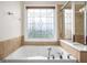 Relaxing bathroom with soaking tub and large shower at 5104 Leeshire Se Trl # 64, Atlanta, GA 30339