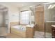 Spa-like bathroom with soaking tub and walk-in shower at 5104 Leeshire Se Trl # 64, Atlanta, GA 30339