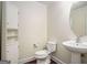 Clean bathroom with pedestal sink and built-in shelving at 5104 Leeshire Se Trl # 64, Atlanta, GA 30339