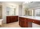 Primary bathroom features double sinks, vanity, tile flooring, soaking tub, and glass shower at 5104 Leeshire Se Trl # 64, Atlanta, GA 30339