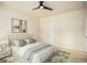 Bright bedroom with ceiling fan and double doors to closet at 5104 Leeshire Se Trl # 64, Atlanta, GA 30339