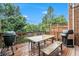 Outdoor deck featuring dining area, grill and green surroundings at 5104 Leeshire Se Trl # 64, Atlanta, GA 30339