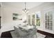 Airy dining room featuring a modern chandelier, neutral decor and lots of natural light at 5104 Leeshire Se Trl # 64, Atlanta, GA 30339