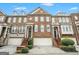 Brick front of charming townhome with attached two-car garage at 5104 Leeshire Se Trl # 64, Atlanta, GA 30339