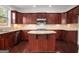 Modern kitchen with granite countertops and dark wood cabinets at 5104 Leeshire Se Trl # 64, Atlanta, GA 30339