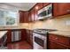 Well-equipped kitchen featuring granite countertops and stainless steel appliances at 5104 Leeshire Se Trl # 64, Atlanta, GA 30339