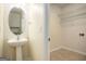 Laundry room with pedestal sink and shelving at 5104 Leeshire Se Trl # 64, Atlanta, GA 30339