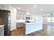 Modern kitchen with gray cabinets, island, and stainless steel appliances at 621 Pineberry Ct, Grayson, GA 30017