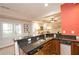 Open bar area with wooden cabinets, a stainless dishwasher, granite countertops, and plenty of space at 4703 Legacy Cove Ln, Smyrna, GA 30126