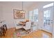 Breakfast nook features a cozy seating area with natural light, wood floors, and access to kitchen at 4703 Legacy Cove Ln, Smyrna, GA 30126