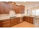 Stylish kitchen features custom wood cabinets, granite counters, stainless appliances, and gas cooktop at 4703 Legacy Cove Ln, Smyrna, GA 30126