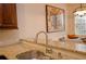 Kitchen with granite counters and stainless steel faucet overlooking a breakfast nook at 4703 Legacy Cove Ln, Smyrna, GA 30126