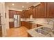 Spacious kitchen with stainless steel appliances, granite countertops and wood cabinets at 4703 Legacy Cove Ln, Smyrna, GA 30126