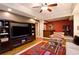 Spacious living room with a built-in entertainment center and an open floor plan view of the bar at 4703 Legacy Cove Ln, Smyrna, GA 30126