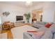 Spacious living room with modern decor, connecting to the dining room for easy flow at 4703 Legacy Cove Ln, Smyrna, GA 30126