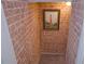 Hallway in brick with a lighthouse artwork at 4703 Legacy Cove Ln, Smyrna, GA 30126