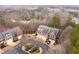 An aerial view of the luxurious townhome community nestled among mature trees and scenic surroundings at 4703 Legacy Cove Ln, Smyrna, GA 30126