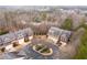 An aerial view of the luxurious townhome community nestled among mature trees and scenic surroundings at 4703 Legacy Cove Ln, Smyrna, GA 30126