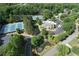 Aerial view of community amenities, including tennis courts, a pool, a clubhouse, and beautifully maintained landscapes at 4703 Legacy Cove Ln, Smyrna, GA 30126