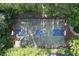 Aerial view of an outdoor basketball court surrounded by trees, a perfect recreational space for residents at 4703 Legacy Cove Ln, Smyrna, GA 30126