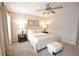 Cozy bedroom featuring a comfortable bed, ceiling fan and neutral decor at 4703 Legacy Cove Ln, Smyrna, GA 30126